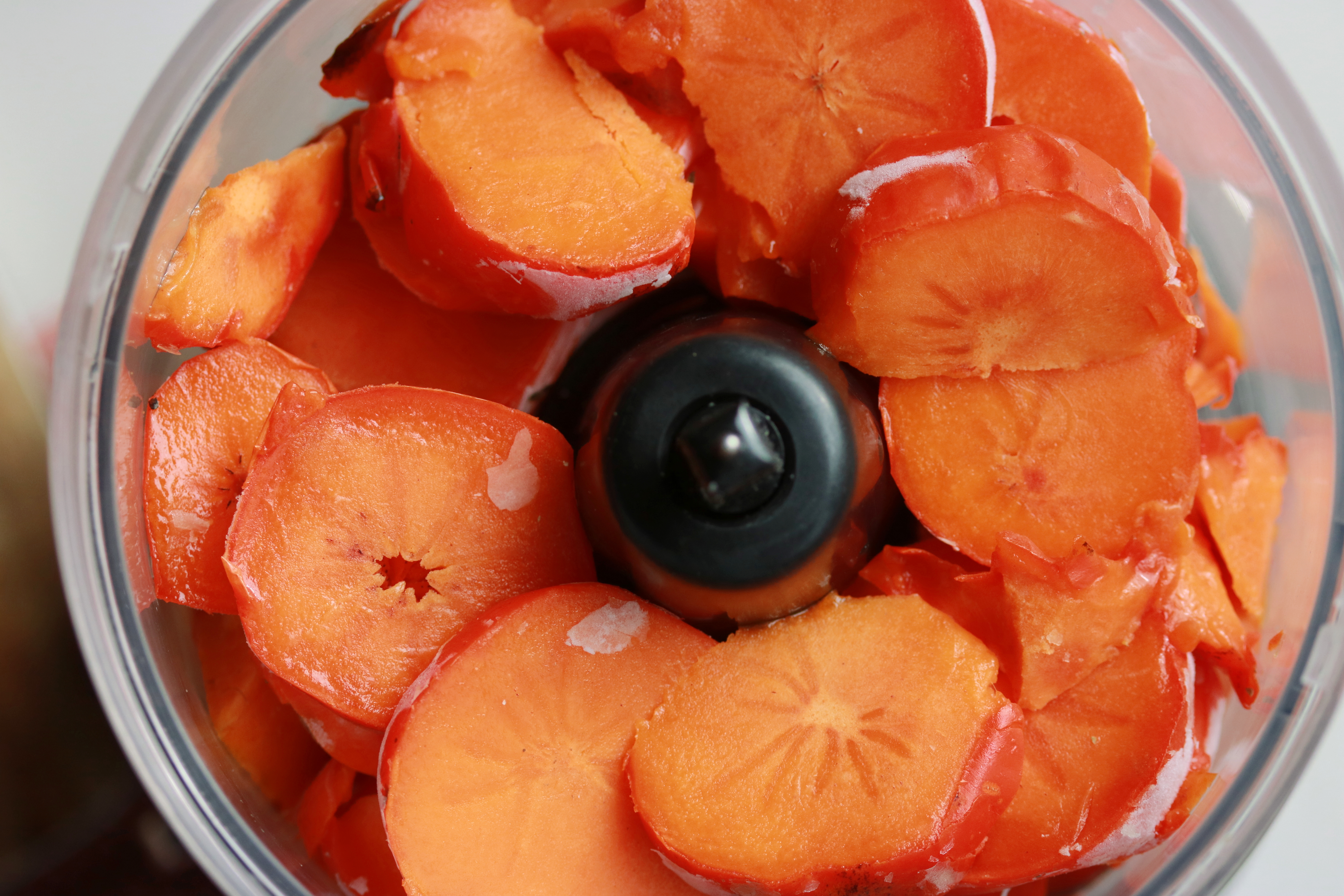 Check out these vibrant frozen persimmons. All you need are these and two other ingredients to make healthy, delicious vegan sorbet. It seriously tastes like pumpkin pie and is so easy to whip up!