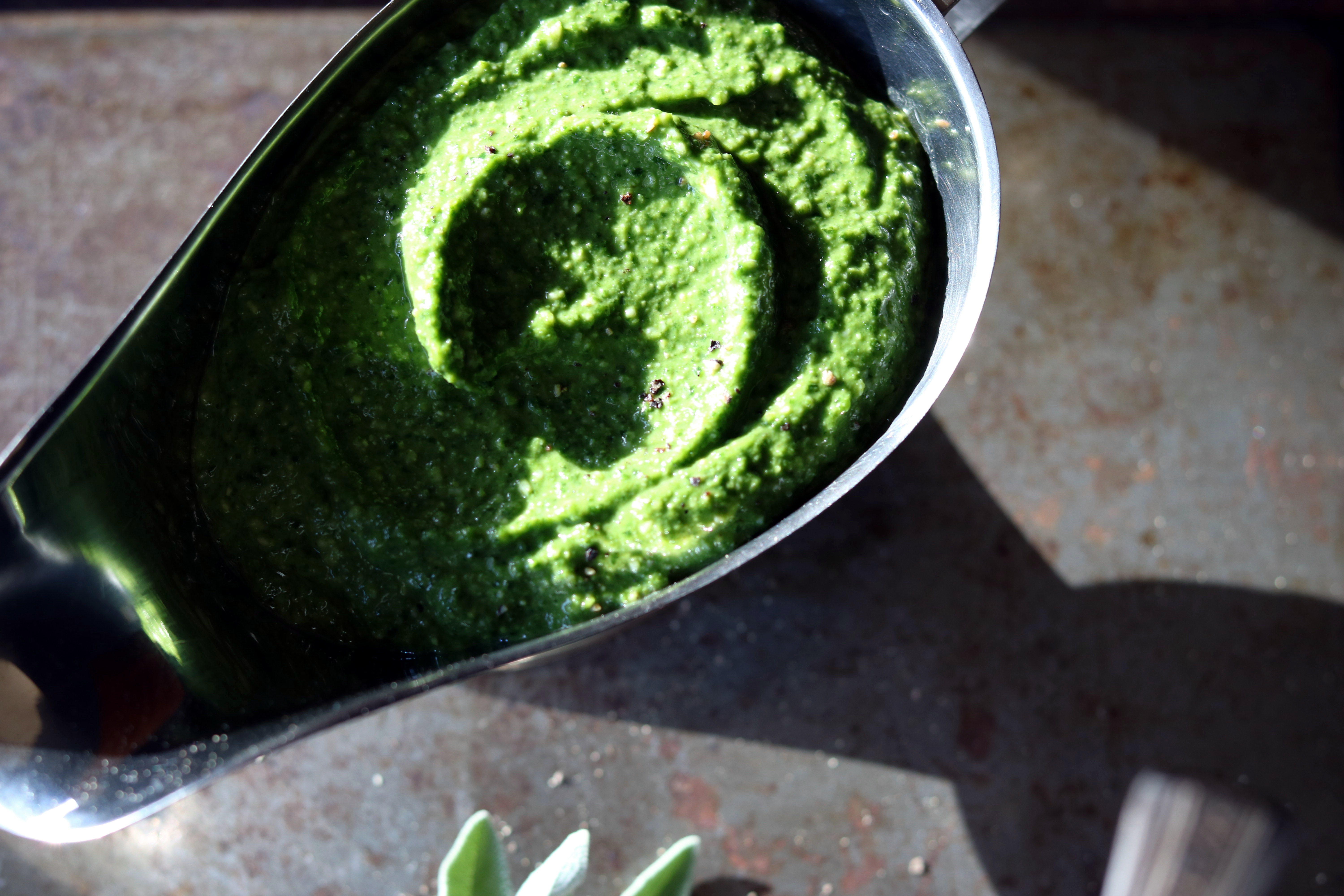 The perfect topping for soup, pasta, grilled vegetables, chicken, fish... the list is endless. Light and a little spicy, this is my families favorite recipe for arugula pesto and it tastes great with this creamy potato and cauliflower soup!