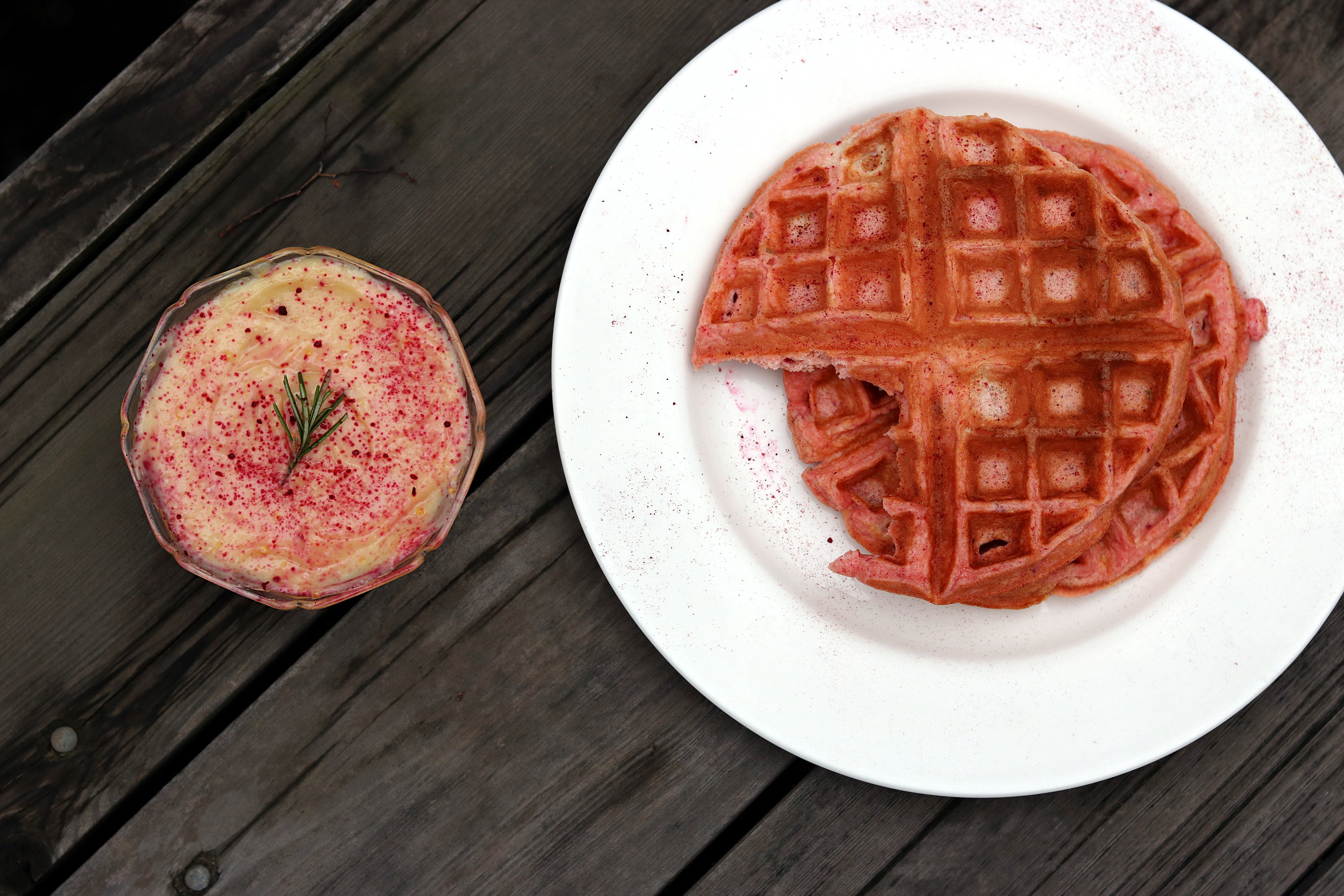 These pink rosemary and lemon Belgian waffles are the perfect way to say I love you for Valentine's day or for any time you are hosting brunch! They sound so gourmet and fancy, but they are a piece of cake (er waffle?) to make! The tart lemon curd and delicate woodiness of the rosemary will have your guests so impressed! And I have a little trick for you that will guarantee the fluffiest waffles time and time again. It takes hardly any extra time and will elevate your waffles from diner to gourmet. Valentine's Day Recipes | Lemon Curd | Belgian Waffle Recipes | Brunch Recipes