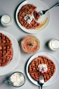 These pink rosemary and lemon Belgian waffles are the perfect way to say I love you for Valentine's day or for any time you are hosting brunch! They sound so gourmet and fancy, but they are a piece of cake (er waffle?) to make! The tart lemon curd and delicate woodiness of the rosemary will have your guests so impressed! And I have a little trick for you that will guarantee the fluffiest waffles time and time again. It takes hardly any extra time and will elevate your waffles from diner to gourmet. Valentine's Day Recipes | Lemon Curd | Belgian Waffle Recipes | Brunch Recipes