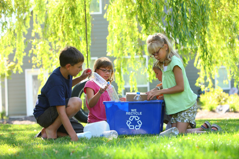 Children recycling in an effort to go green at school